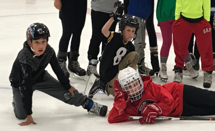 kids with hockey sticks